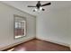 Bedroom with hardwood floors and a large window at 1100 E Louisiana Ave, Tampa, FL 33603