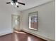 Bedroom with hardwood floors and bathroom access at 1100 E Louisiana Ave, Tampa, FL 33603