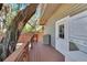 Wooden deck with storage and a door leading to the house at 1100 E Louisiana Ave, Tampa, FL 33603