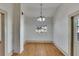 Dining room with hardwood floors and exposed brick at 1100 E Louisiana Ave, Tampa, FL 33603