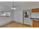 Dining room with hardwood floors and door to outside at 1100 E Louisiana Ave, Tampa, FL 33603