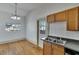 Bright dining room with hardwood floors and chandelier at 1100 E Louisiana Ave, Tampa, FL 33603