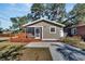 Tan house with a screened porch and deck at 1100 E Louisiana Ave, Tampa, FL 33603
