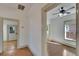 Hallway with wood floors and access to bedrooms at 1100 E Louisiana Ave, Tampa, FL 33603