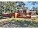 House exterior with wooden deck and fenced yard at 1100 E Louisiana Ave, Tampa, FL 33603