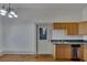 Kitchen with wood cabinets, stainless steel appliances, and hardwood floors at 1100 E Louisiana Ave, Tampa, FL 33603