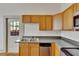 Kitchen sink and countertops with wood cabinets at 1100 E Louisiana Ave, Tampa, FL 33603
