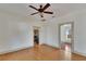 Bright living room with hardwood floors and ceiling fan at 1100 E Louisiana Ave, Tampa, FL 33603