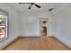 Living room with hardwood floors and kitchen view at 1100 E Louisiana Ave, Tampa, FL 33603