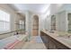 Elegant bathroom with double vanity, soaking tub, and walk-in shower at 13230 Fawn Lily Dr, Riverview, FL 33579