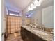 Clean bathroom with double vanity and granite countertop at 13230 Fawn Lily Dr, Riverview, FL 33579