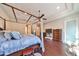 Bright bedroom with hardwood floors and a comfortable bed at 13230 Fawn Lily Dr, Riverview, FL 33579