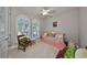 Charming bedroom with a daybed and ample natural light at 13230 Fawn Lily Dr, Riverview, FL 33579