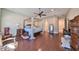 Spacious bedroom with hardwood floors and a large canopy bed at 13230 Fawn Lily Dr, Riverview, FL 33579