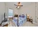 Comfortable bedroom with a double bed and window seat at 13230 Fawn Lily Dr, Riverview, FL 33579