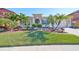 Single-story home with landscaped lawn and two-car garage at 13230 Fawn Lily Dr, Riverview, FL 33579