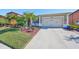 House exterior showcasing a well-manicured lawn and driveway at 13230 Fawn Lily Dr, Riverview, FL 33579