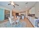 Open concept kitchen with island, stainless steel appliances, and white cabinetry at 13230 Fawn Lily Dr, Riverview, FL 33579