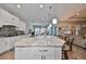 Large kitchen island with granite countertops and seating at 13230 Fawn Lily Dr, Riverview, FL 33579