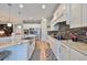 Bright kitchen with white cabinets and granite countertops at 13230 Fawn Lily Dr, Riverview, FL 33579