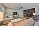 Spacious living room with built-in shelving, hardwood floors, and ample natural light at 13230 Fawn Lily Dr, Riverview, FL 33579