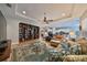 Spacious living room with built-in shelving and hardwood floors at 13230 Fawn Lily Dr, Riverview, FL 33579