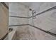 Large walk-in shower with pebble floor and built-in seat at 13230 Fawn Lily Dr, Riverview, FL 33579