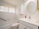 Bright bathroom featuring a vanity with an oval mirror at 14181 89Th Ave, Seminole, FL 33776