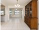 Dining room with tile floor and wooden hutch at 14181 89Th Ave, Seminole, FL 33776