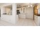 White kitchen with granite countertops and ample cabinet space at 14181 89Th Ave, Seminole, FL 33776