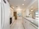 White kitchen with granite countertops and stainless steel appliances at 14181 89Th Ave, Seminole, FL 33776