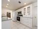 White kitchen with ample cabinetry and a built-in microwave at 14181 89Th Ave, Seminole, FL 33776