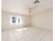Empty living room with tile floors and ceiling fan at 14181 89Th Ave, Seminole, FL 33776