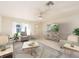 Bright living room features stylish furniture, a large TV, and a comfy seating area at 14181 89Th Ave, Seminole, FL 33776