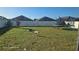 Large backyard with trampoline and fire pit at 14207 Alistar Manor Dr, Wimauma, FL 33598