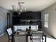 Kitchen with an island and adjacent dining area with table and chairs at 14207 Alistar Manor Dr, Wimauma, FL 33598