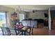 Open living and dining area with hardwood floors and a comfortable seating area at 14207 Alistar Manor Dr, Wimauma, FL 33598