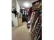 Walk-in closet with clothing racks and shelving at 14207 Alistar Manor Dr, Wimauma, FL 33598