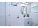 Small bathroom with white vanity, mirror, and toilet at 220 45Th Ave, St Pete Beach, FL 33706