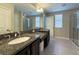 Modern bathroom boasting double sinks and granite countertops at 2408 E Chelsea St, Tampa, FL 33610