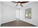 Bright bedroom with ceiling fan and hardwood floors at 2515 W Comanche Ave, Tampa, FL 33614