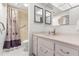 Bathroom with vanity, shower, and floral shower curtain at 2650 Pearce Dr # 403, Clearwater, FL 33764