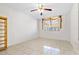 Bedroom with tile floors, ceiling fan, and bookshelf at 2650 Pearce Dr # 403, Clearwater, FL 33764