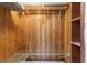 Large walk-in closet with wood paneling and wire shelving at 2650 Pearce Dr # 403, Clearwater, FL 33764