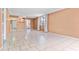 Bright living room featuring tile floors and access to hallway and kitchen at 2650 Pearce Dr # 403, Clearwater, FL 33764