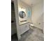 Bathroom with walk-in shower and granite countertop at 3208 Deleuil Ave, Tampa, FL 33610