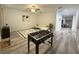 Bright game room features foosball table and comfortable seating at 3208 Deleuil Ave, Tampa, FL 33610