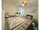 Open living area showcasing a comfortable sectional sofa, foosball table, and stylish rug at 3208 Deleuil Ave, Tampa, FL 33610