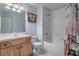 Clean bathroom with a bathtub, shower, and updated vanity at 4904 Barnstead Dr, Riverview, FL 33578