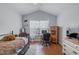 Cozy bedroom with a built-in desk and large window at 4904 Barnstead Dr, Riverview, FL 33578